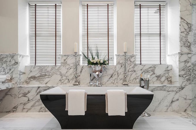 dark-indulgence-black-bathtubs-Beautiful-contemporary-bathtub-in-black-set-against-a-marble-backdrop