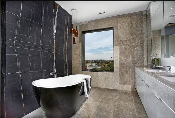 bathroom with bold and roud bathtub maison valentina